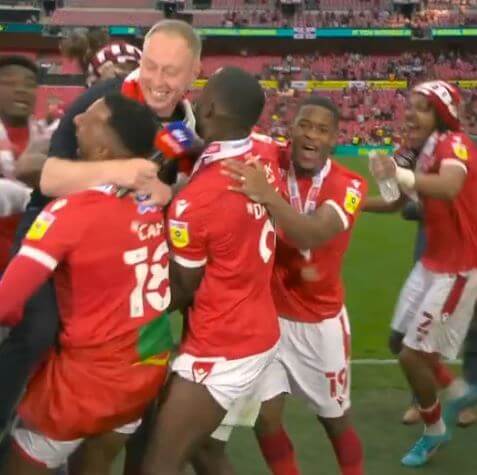 Nottingham Forest Players celebrating with their head coach Steve Cooper.